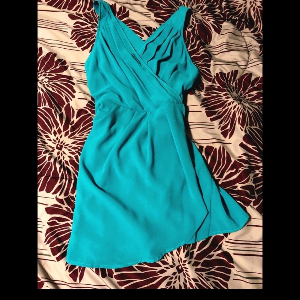 Tobi: Teal dress with crisscross back.